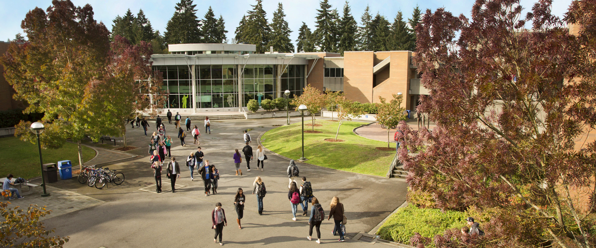 Image of students walking across courtyard outside Bellevue College cafeteria