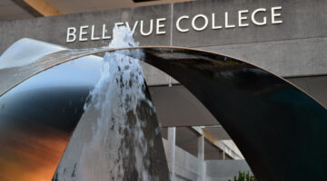 Bellevue College fountain with campus signage visible in the background.