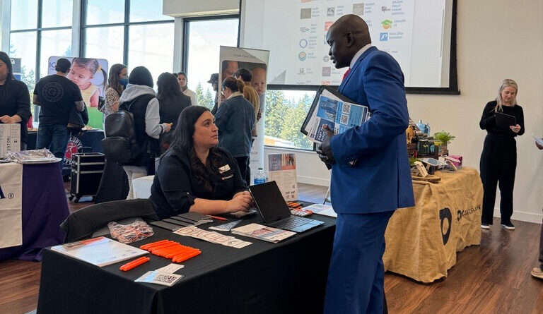 two people networking while attending the Bellevue college's job fair