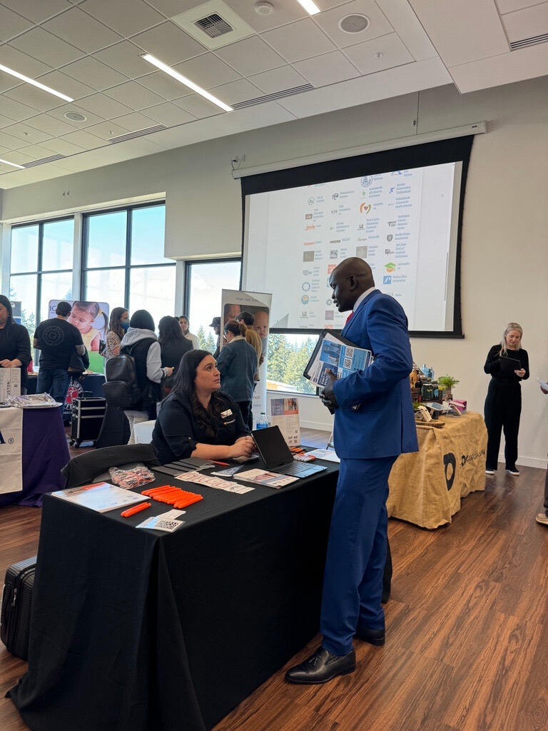 Two people networking while attending Bellevue college's job fair