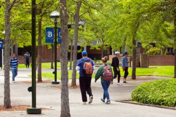 A photo of Bellevue college's campus and students walking around
