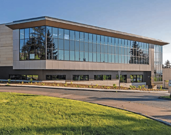 A photo of Bellevue college's campus, highlighting the U building on a sunny day