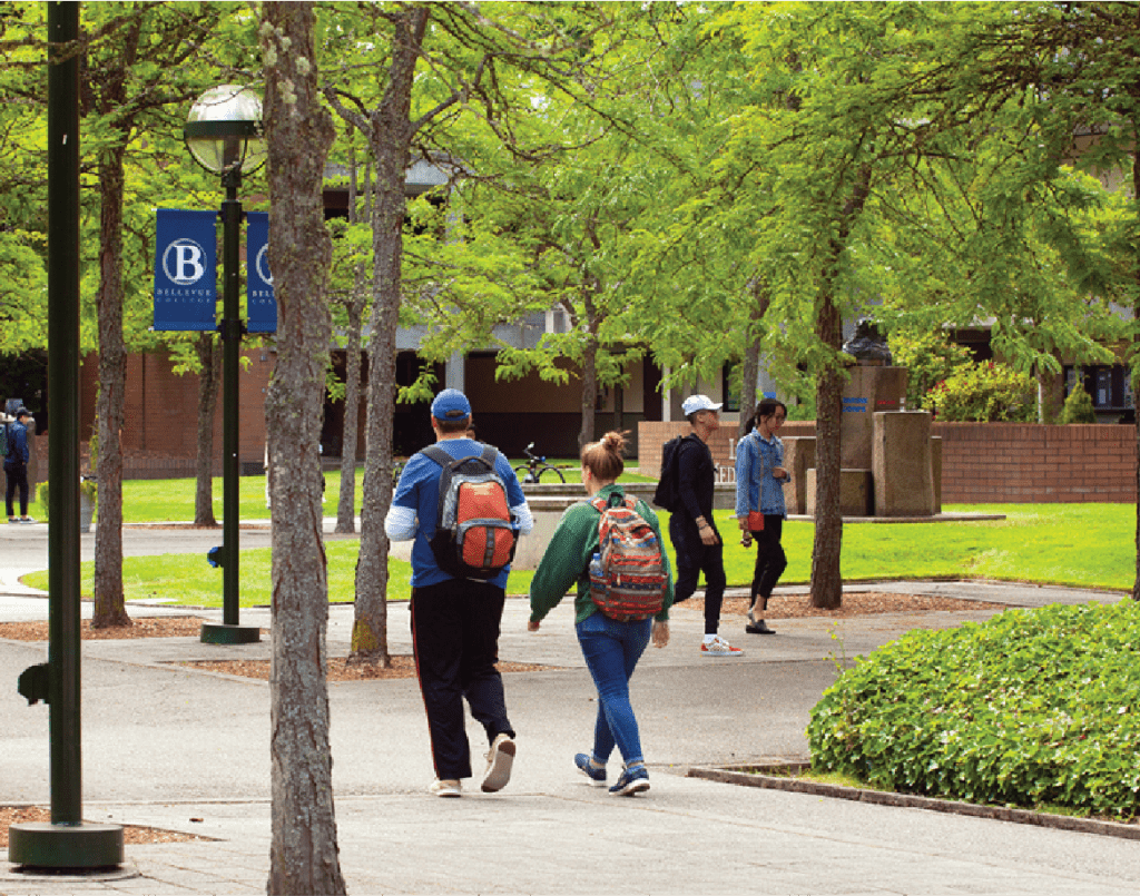 photo of Bellevue college's campus while students walk around 