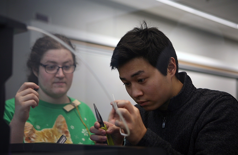 Two students collaborate on a project in BC's MakerSpace.