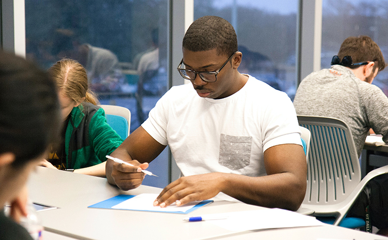 A student works on an assignment during class.