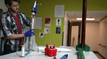 A student working on a rocket in BC's MakerSpace.