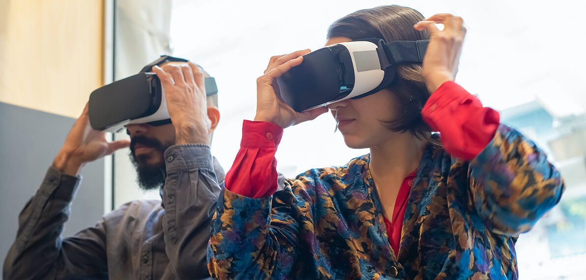 Two people using VR headsets