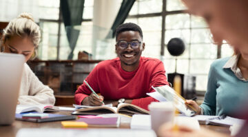 Male student, smiling.