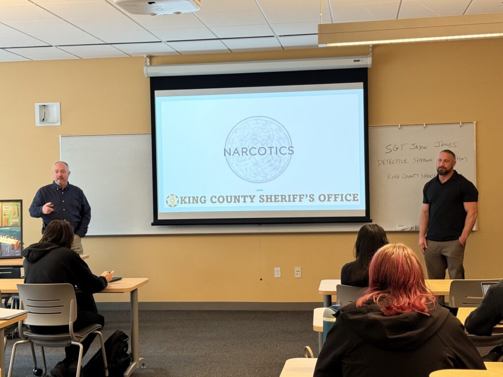 Detectives giving presentation about narcotics