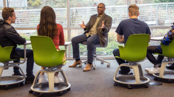 Advisor talking to group of students