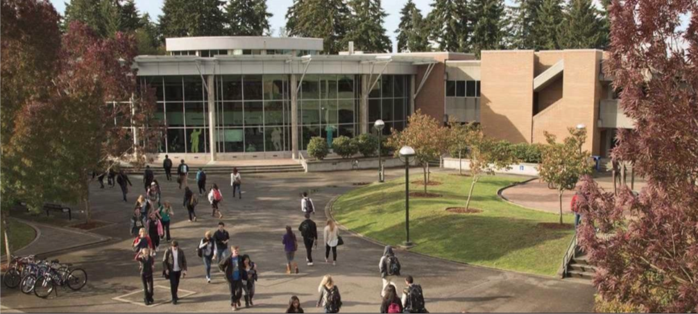 photograph of Bellevue College with students walking to and from class