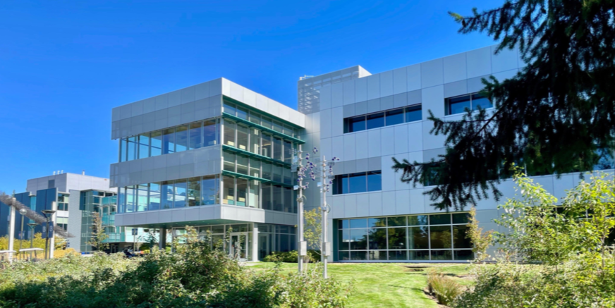 Image of Bellevue College against clear blue sky
