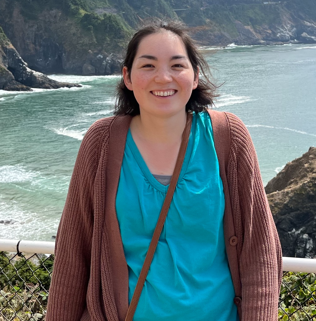 Data Management and Analytics Program Manager Amber Kelly, standing in front of a cove