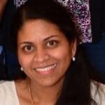 Headshot of Raji Sundar smiling.
