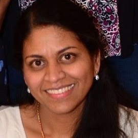 profile headshot of Raji Sundar smiling
