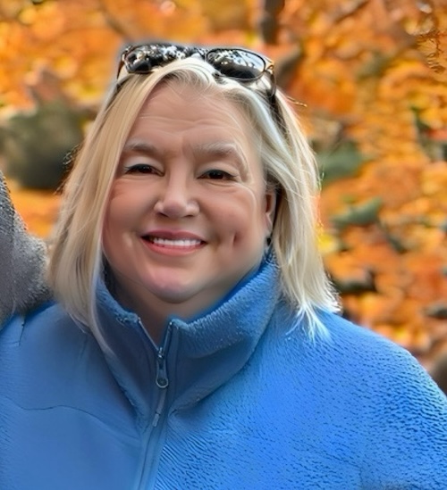 Jackie Hubbard outside on a fall day smiling