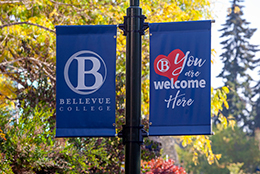 Banners flying on the BC campus say "Bellevue College" and "You are welcome here."