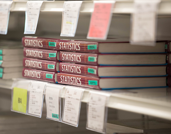 Textbooks rest on the shelves of the BC Bookstore.