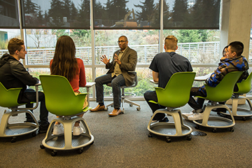 Faculty and students engage in a class discussion.