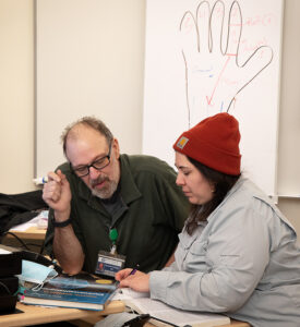 A student and instructor work one-on-one.