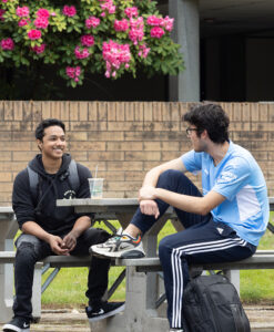 Students chat outside on the BC campus.