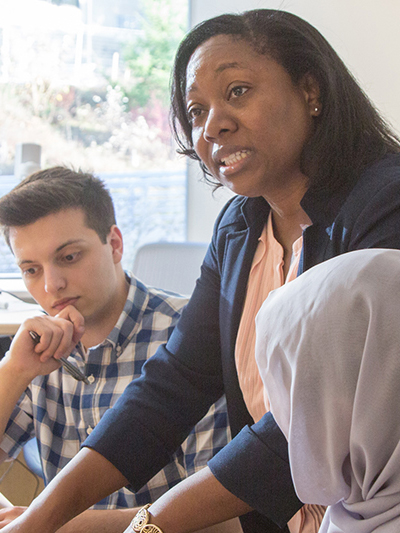 Faculty and students in the classroom.