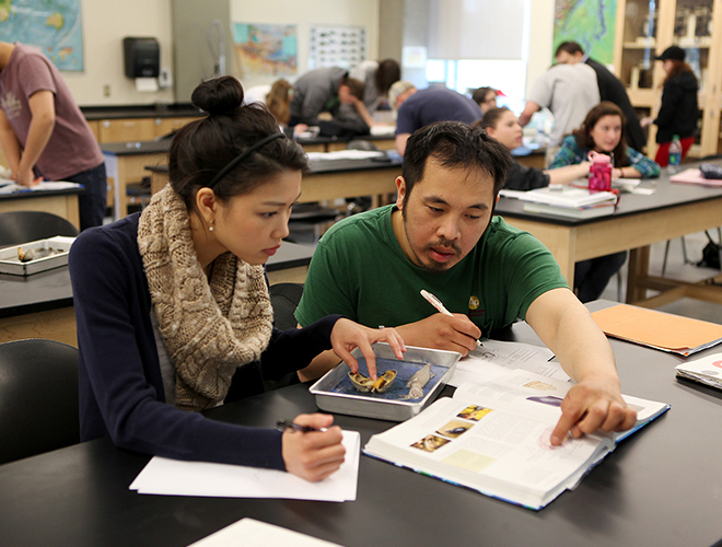 Students collaborate in a science lab.