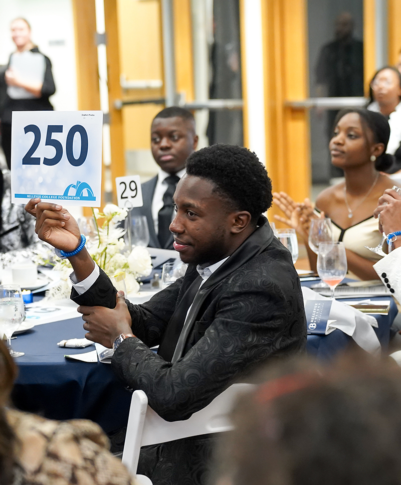 Guests raise signs to bid on auction items at the BC Foundation Gala.