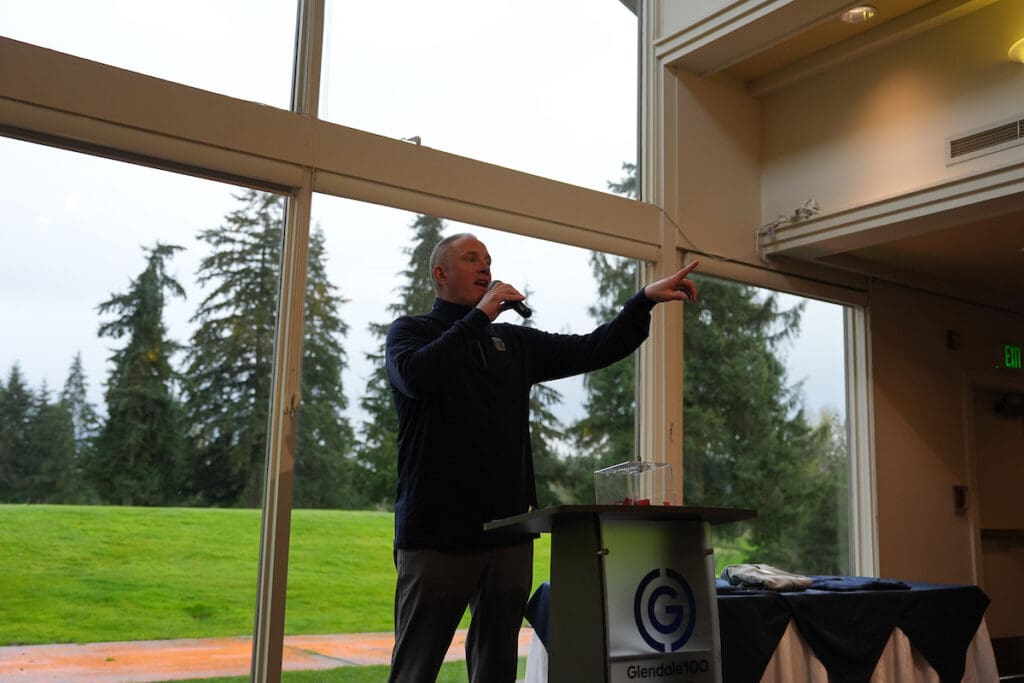 Jeremy Eggers, Bellevue College Athletics Director, speaks at the 2025 Golf Scramble awards banquet