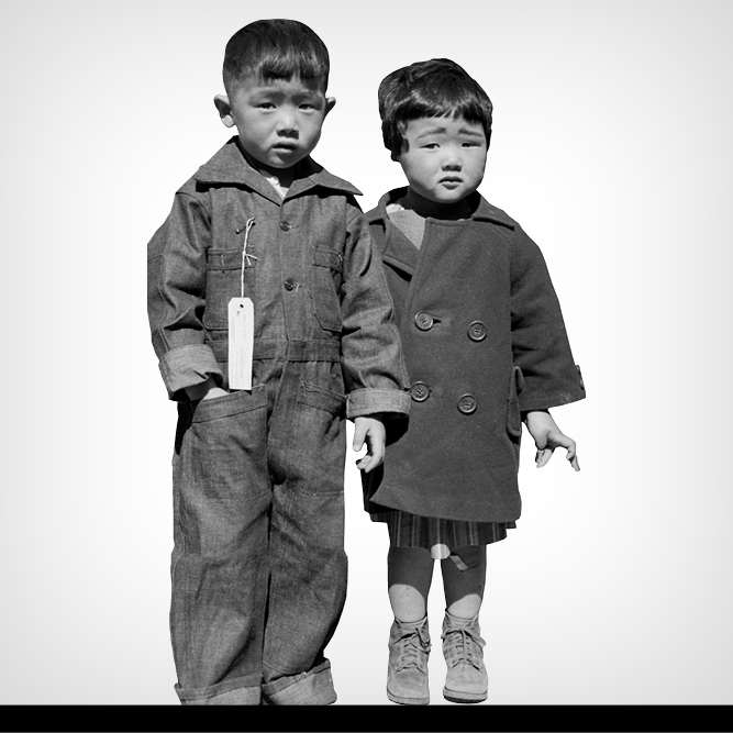 Black and white photo of two young Japanese children, a boy and a girl