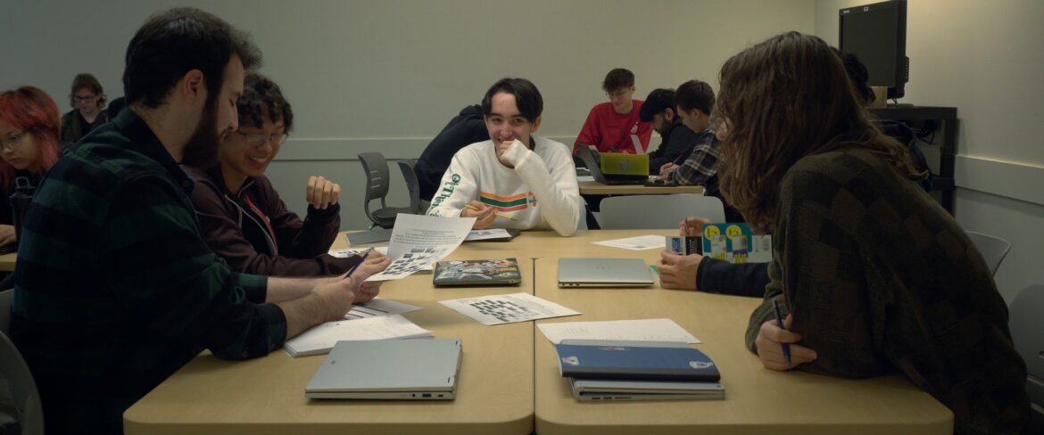 Students seating, studying together.