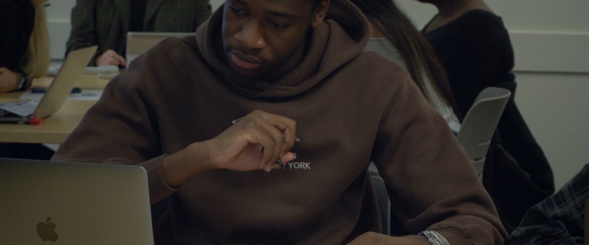Student with computer studying