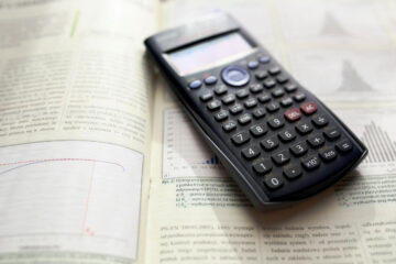 Graphing Calculator sitting on open textbook