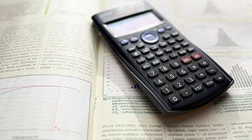Graphing Calculator sitting on open textbook