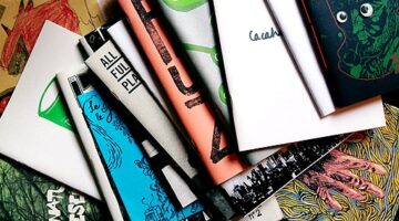 Colorful stack of zines with no visible words