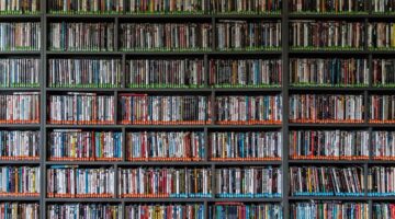 A wall size shelf of DVDs