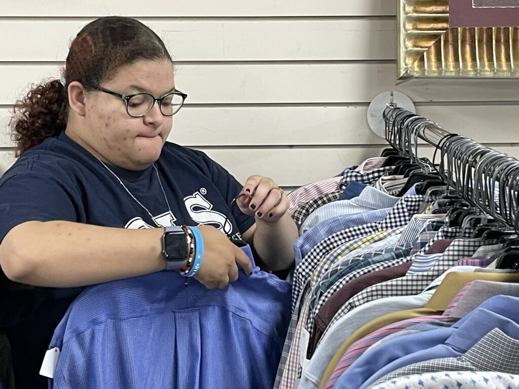 OLS student works in a thrift store.