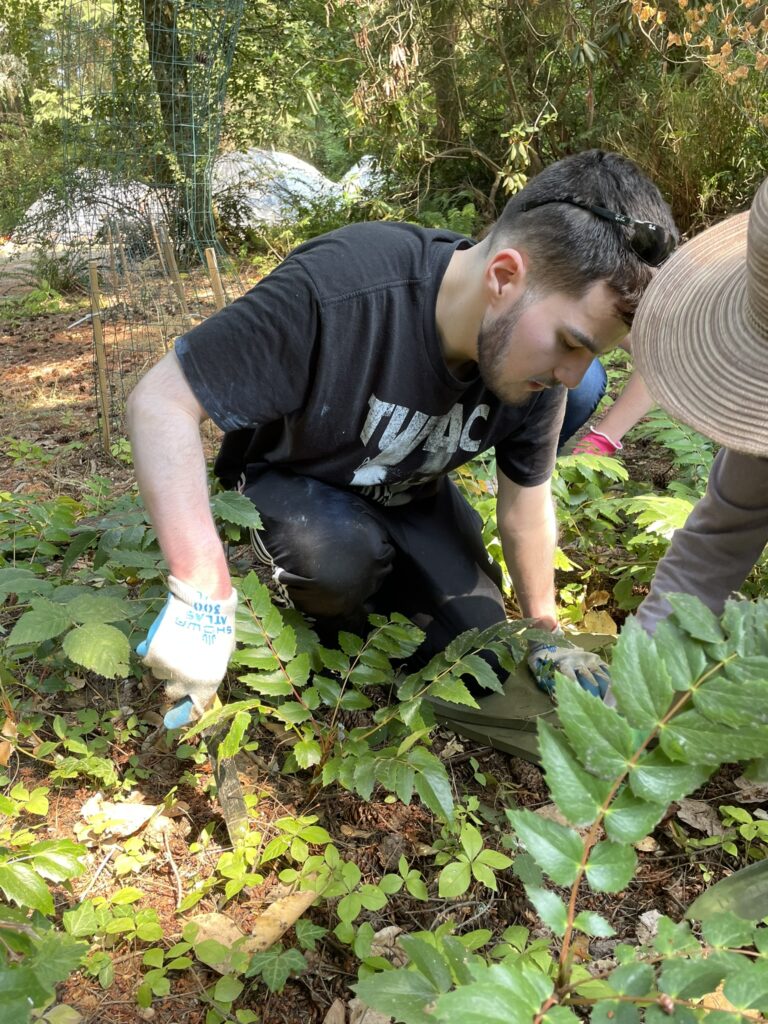 OLS student working in garden