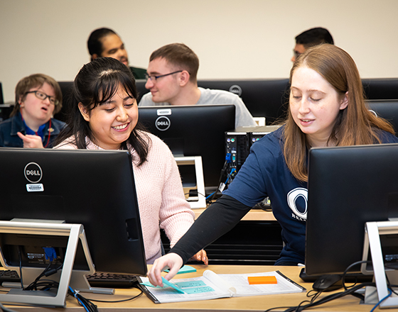 OLS students work together in the computer lab.