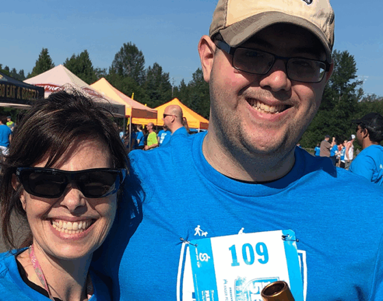 An OLS student with his mom at the Big Backyard 5K event.