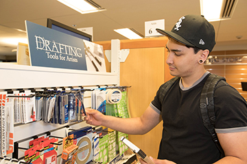 A student shops for supplies at the BC Bookstore.