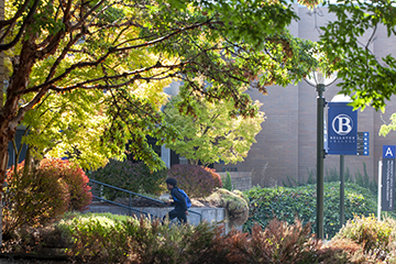 A student walks on the Bellevue College campus.