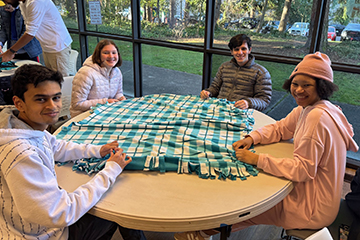 OLS students make blankets for local hospitals.