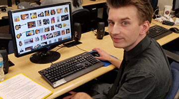 A student works on a computer in class.