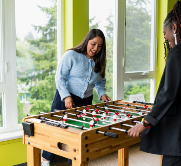 Students play fooseball in BC's residence hall.