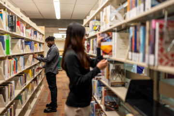 Students look for books in the Bellevue College Library Media Center.