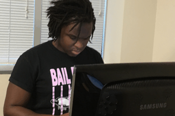 A student works on a computer.