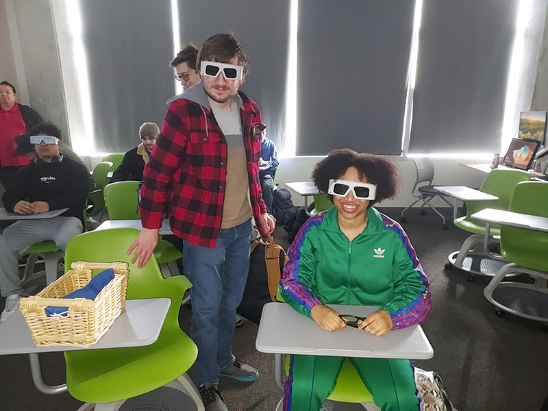 OLS students model special glasses used on the Health Sciences, Education and Wellness Institute tour.