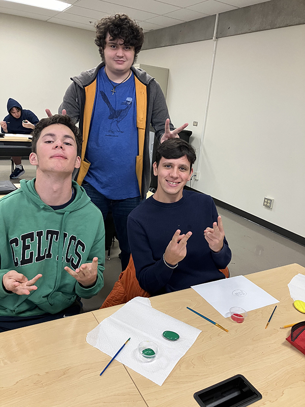 OLS students paint kindness rocks.