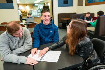 Students reviewing paperwork together